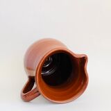 Vintage pitcher in glazed earth