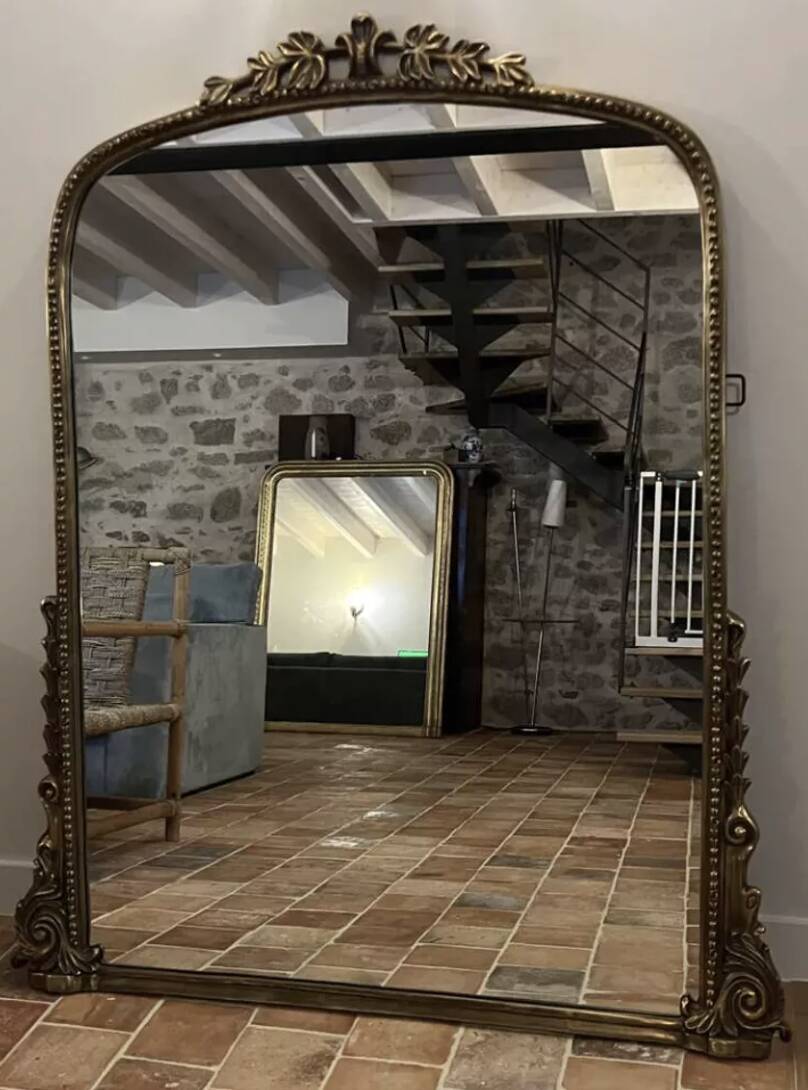 Large gilded mirror with pediment