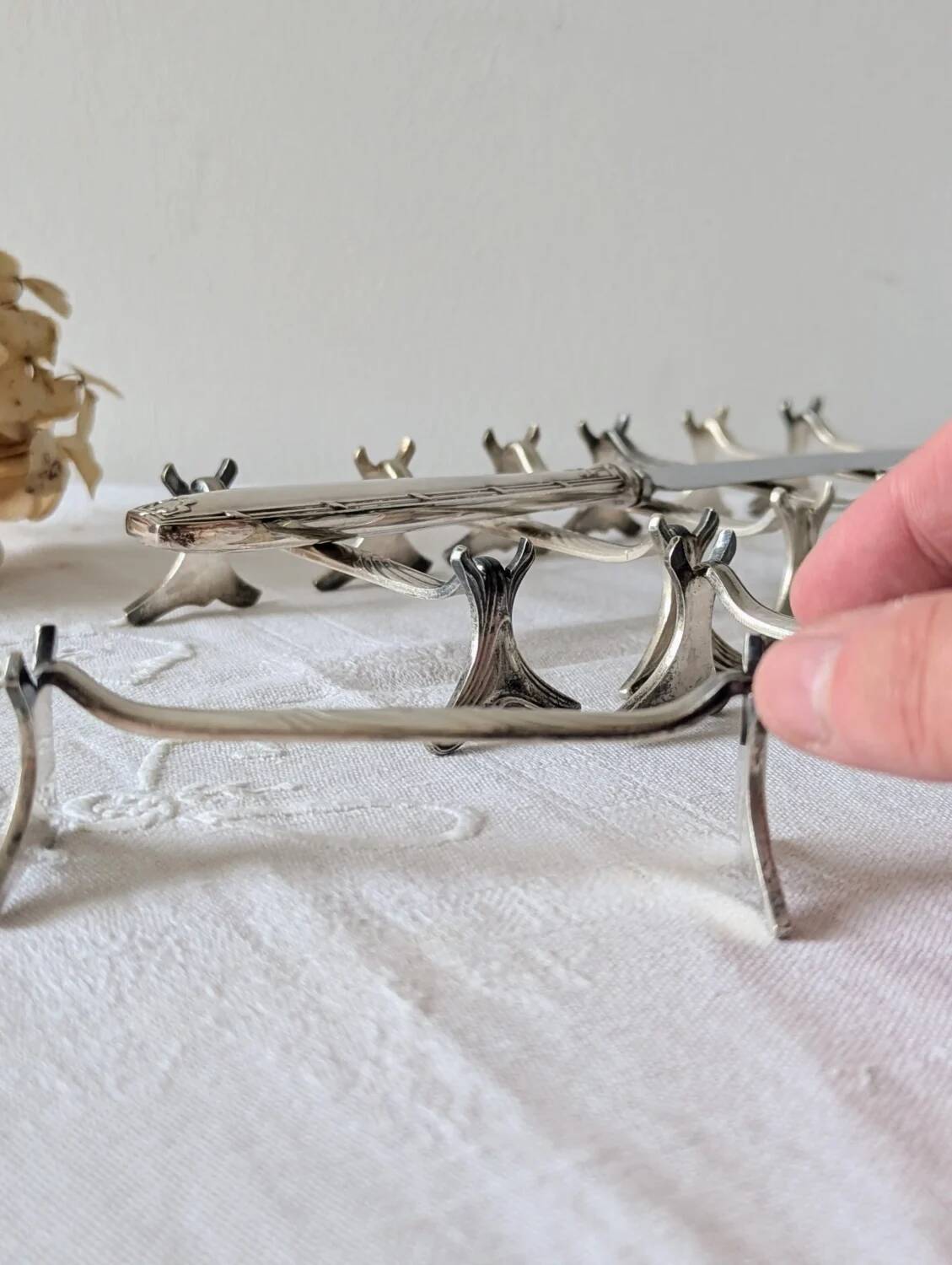 Set of 12 Christofle knife rests, Moderne 1912 model