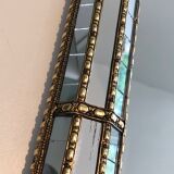 Mirror consisting of multi-faceted mirrors and brass garlands, French work, around 1970