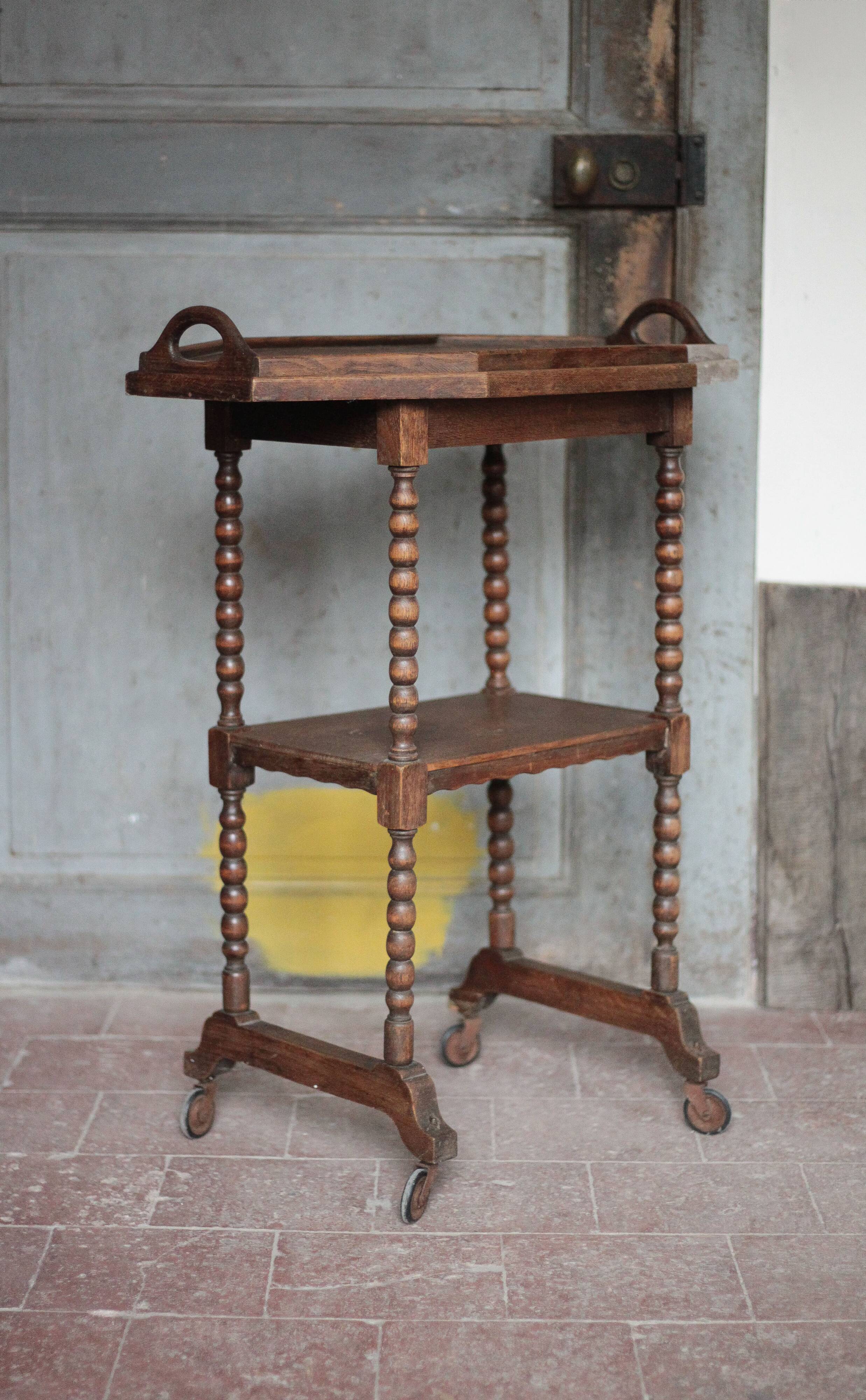 Vintage turned wood dessert trolley, wheeled table with removable top.