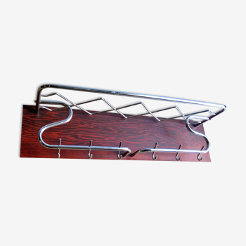 Chrome metal in a rosewood veneer board coat rack