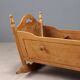 Antique cradle made of fruitwood and maple, Italy, 20th century
