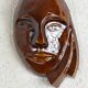 Signed brown enamel mask
