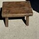 Small stool, rectangular solid teak side table with curved legs.