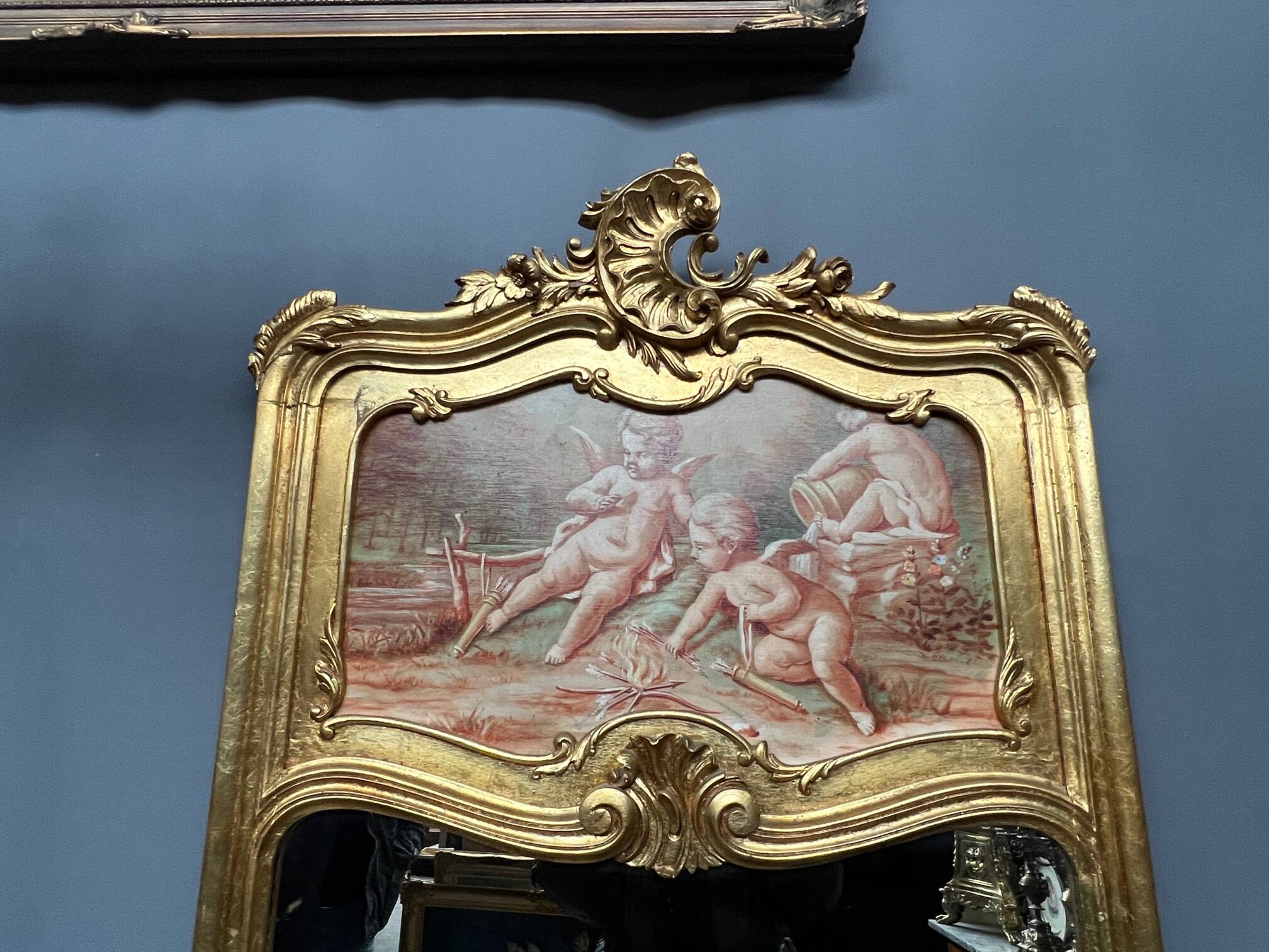 Antique Rococo mirror with cherubs