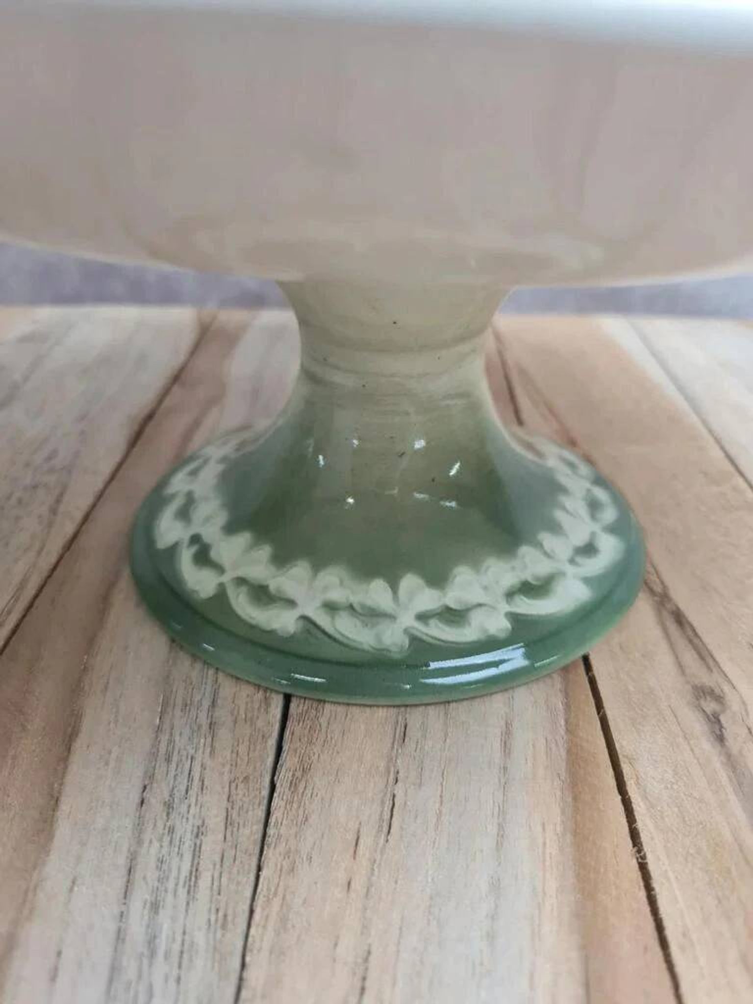 Antique compote stand Lunéville St Clément with green clover decoration.