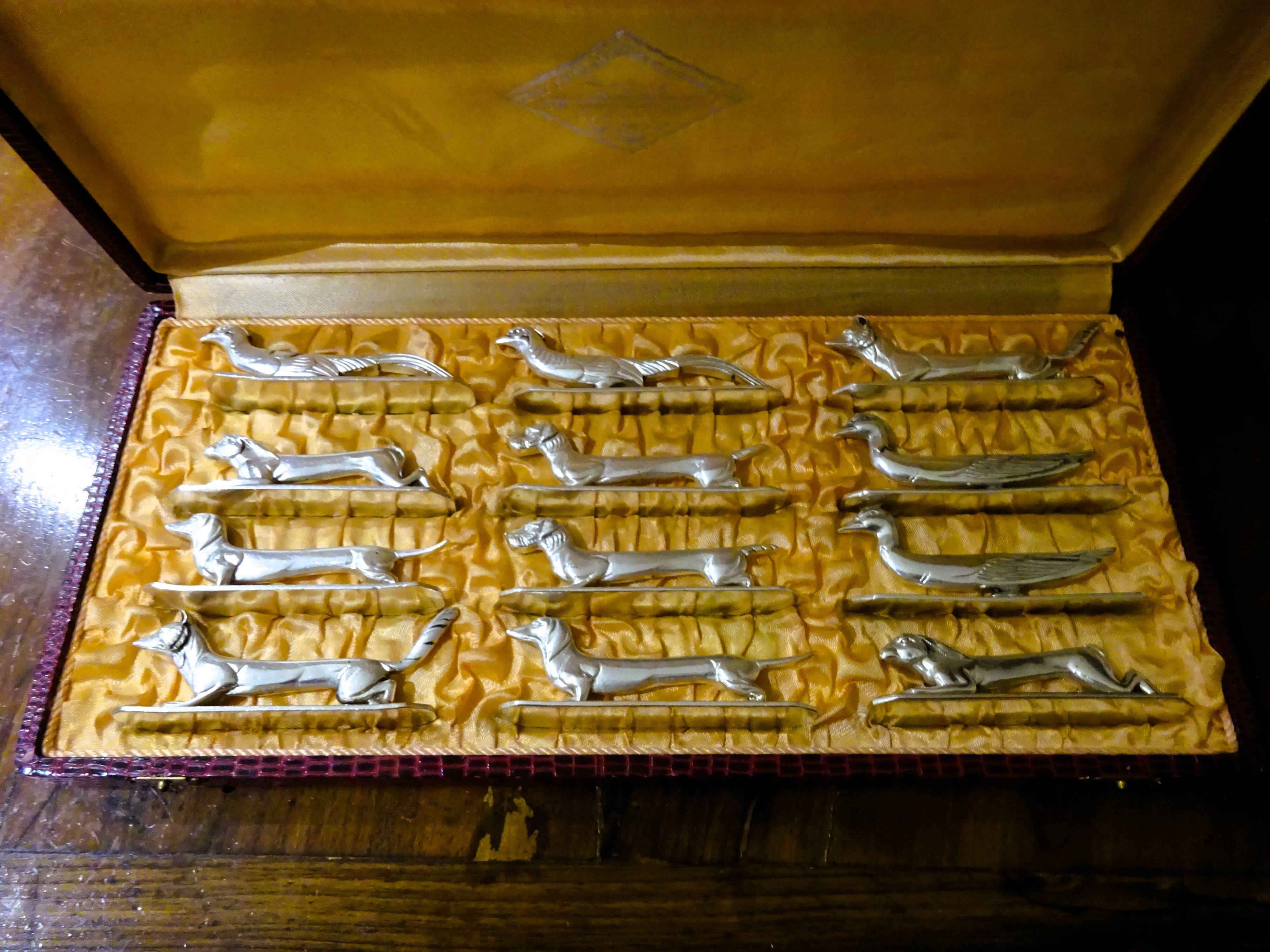 12 Art Deco animal knife holders in silvered bronze