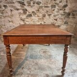 Antique French walnut table with six drawers, parquet top, early 20th century.