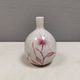 A vase in crackled porcelain with pink decoration. Germany 1930s