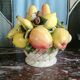 Basket with ceramic fruit decoration