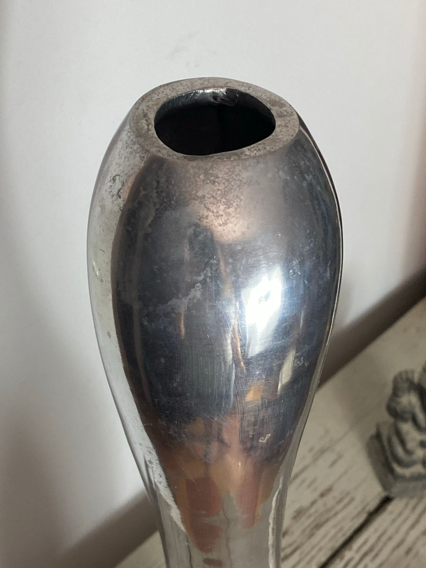 Large organic vase in polished aluminium cast.