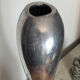 Large organic vase in polished aluminium cast.