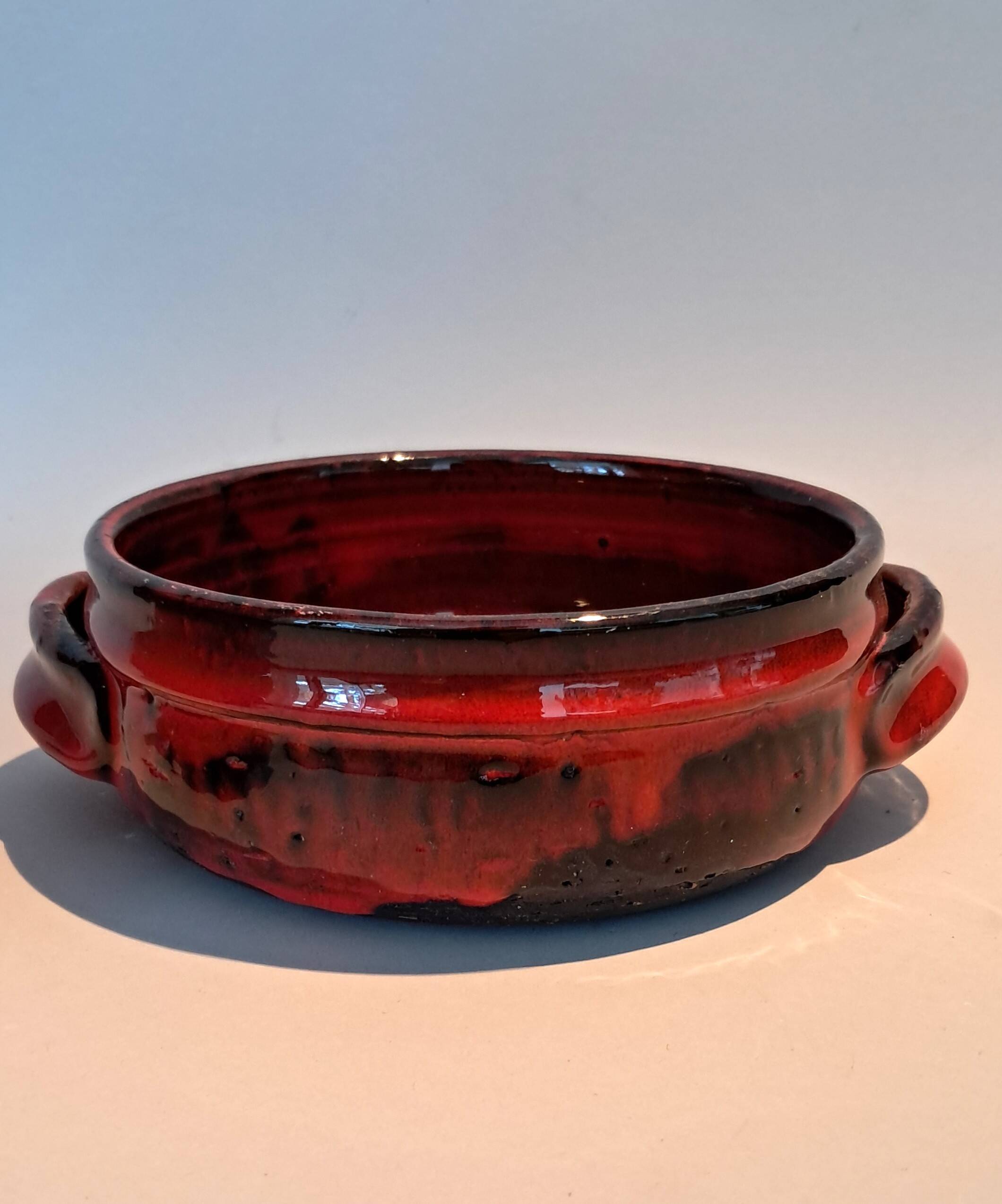 Red ceramic pieces by Gérard Hoffman (1917/1965).