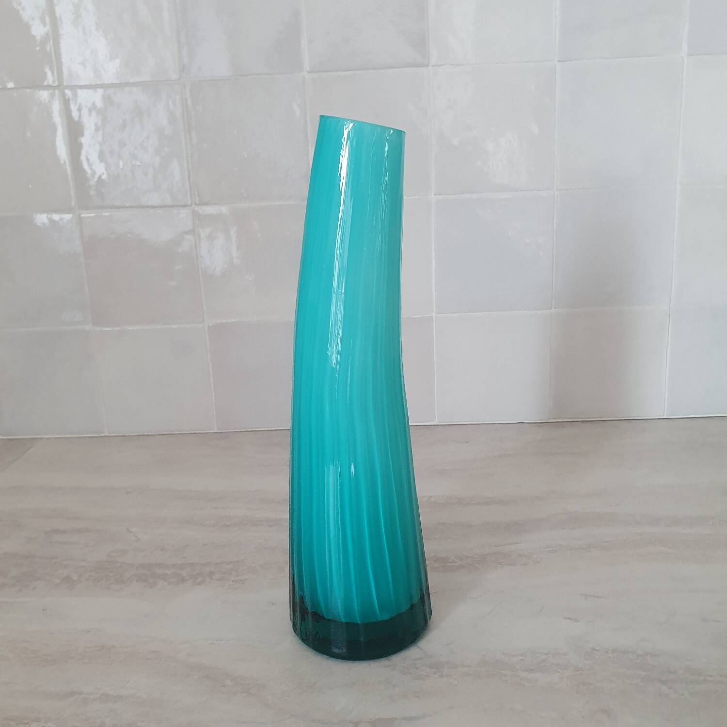 Curved turquoise blue blown glass soliflore vase