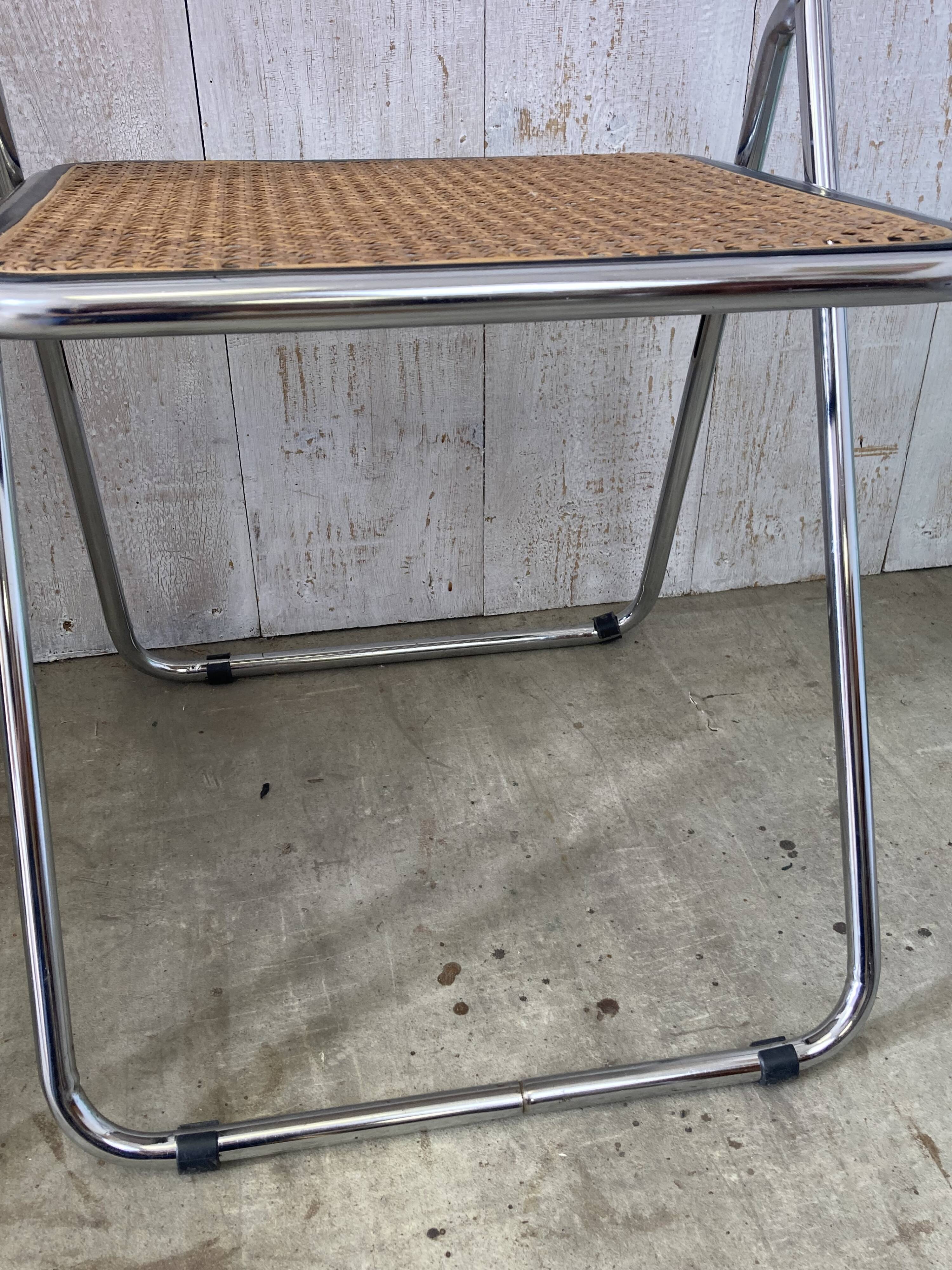 Pair of chrome and cane folding chairs