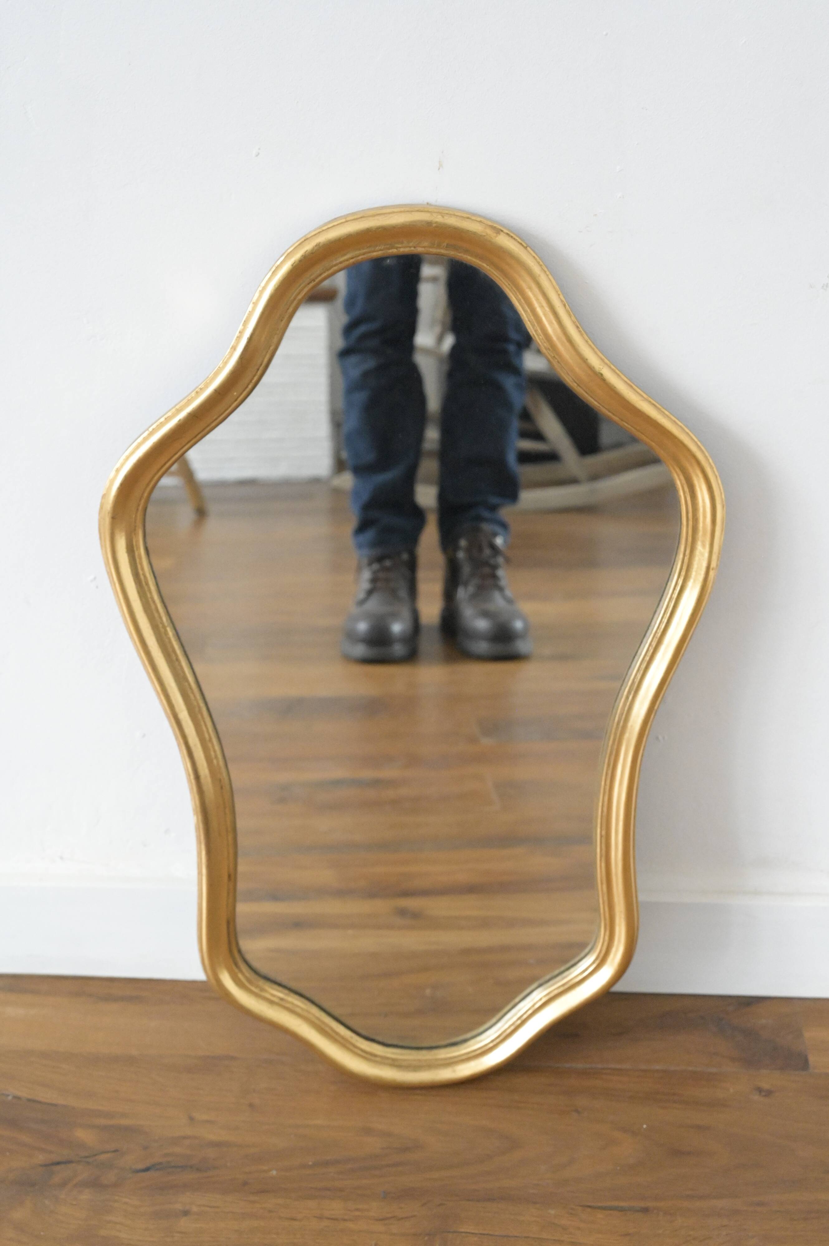 Golden mirror in wood and gold leaf