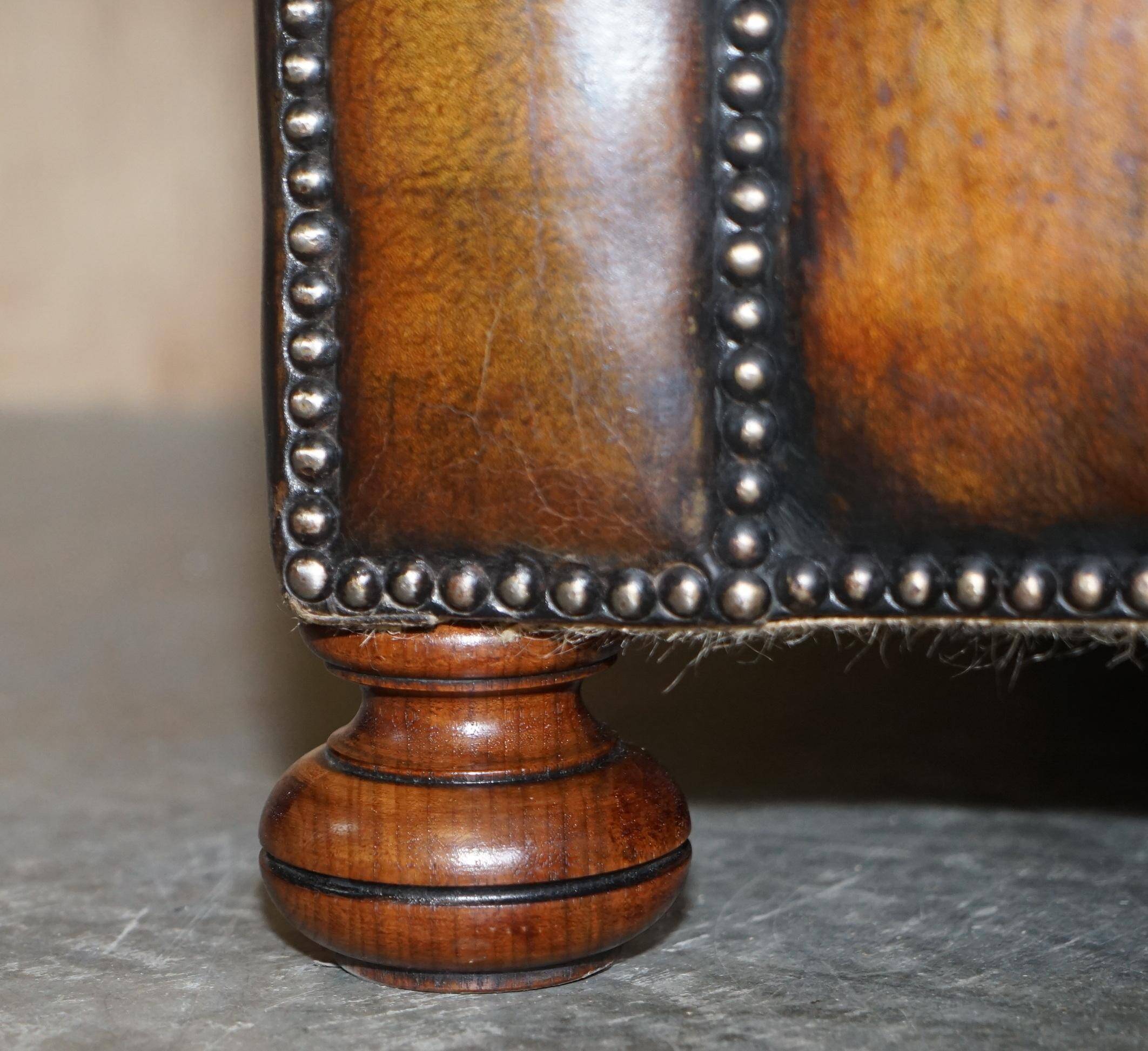 Restored leather Chesterfield sofa, walnut legs.