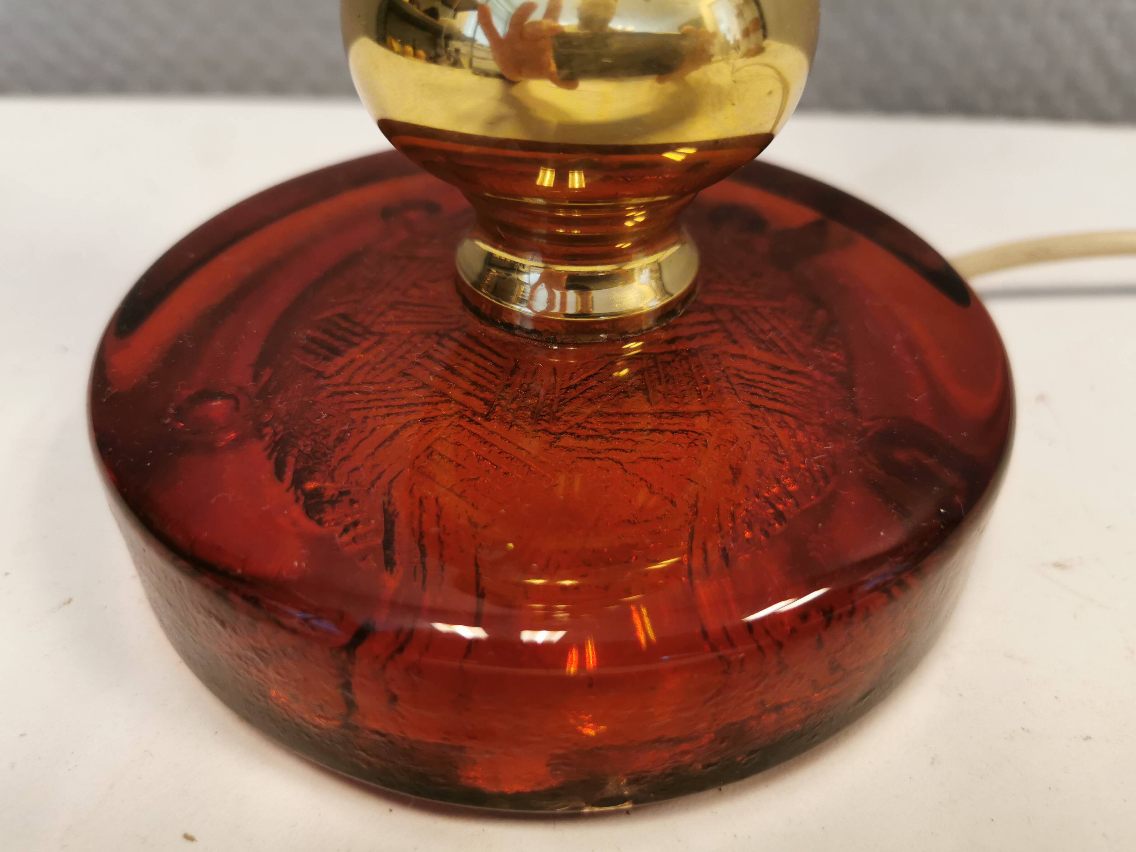 Table lamp from Danish Vitrika in brass, amber colored hard pressed glass, with a shade holder.