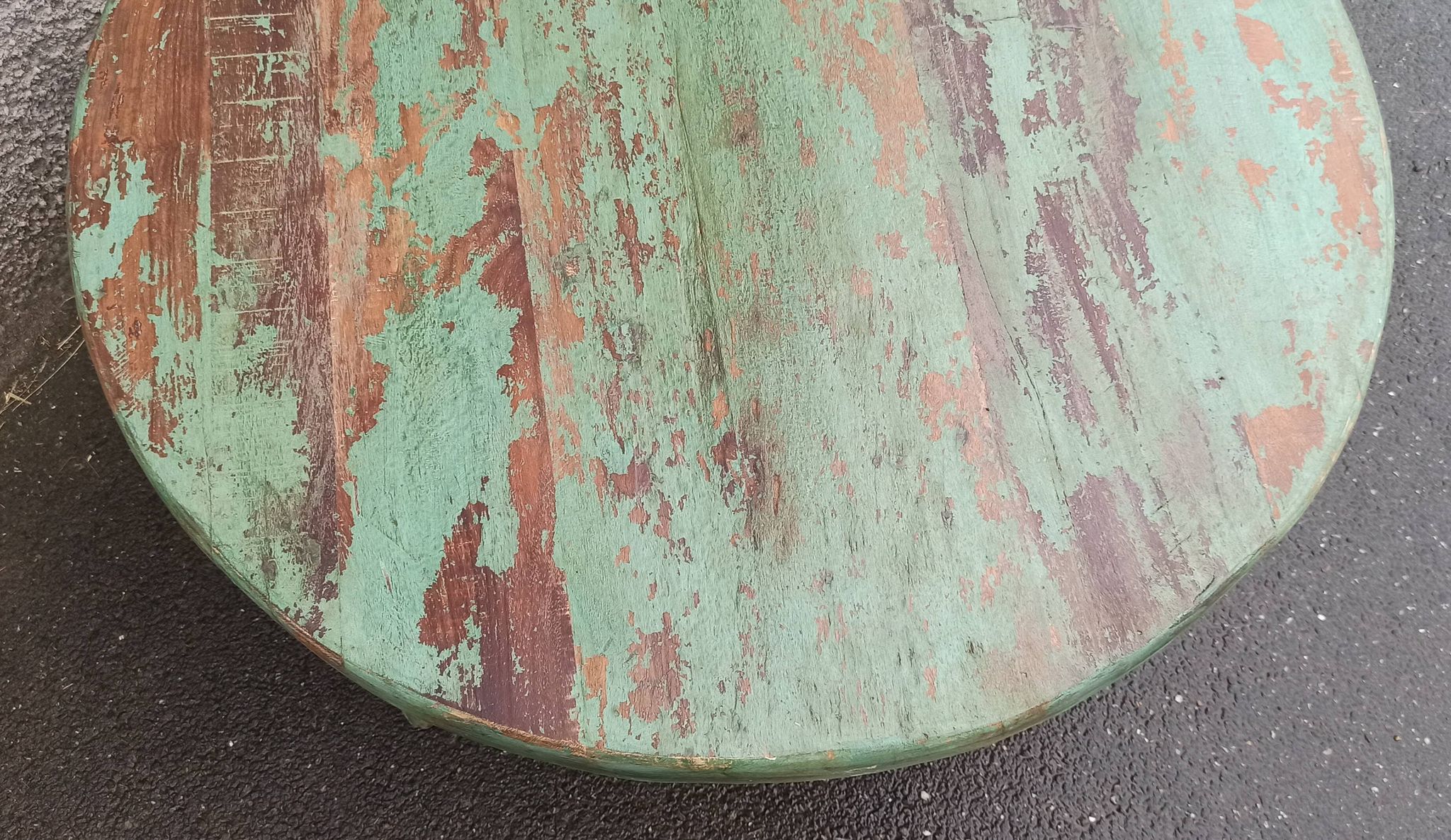 Round coffee table in old green wood