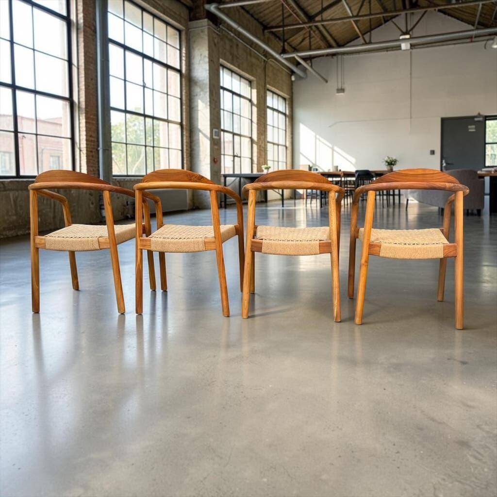 Set of 4 solid wood chairs with cord and armrests.