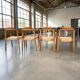 Set of 4 solid wood chairs with cord and armrests.