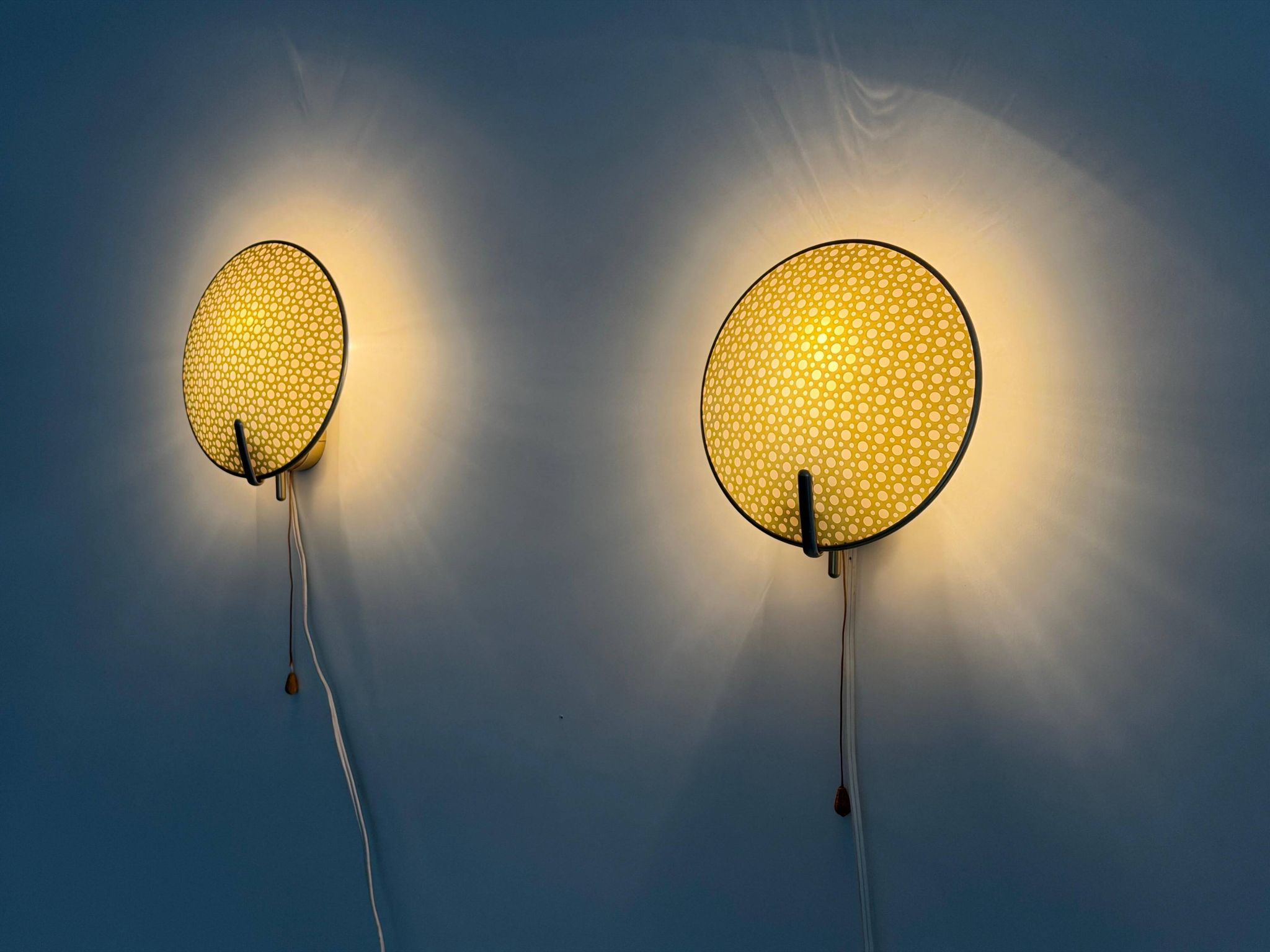Pair of green plexiglass and gold metal wall lights by Erco, 1950s, Germany.