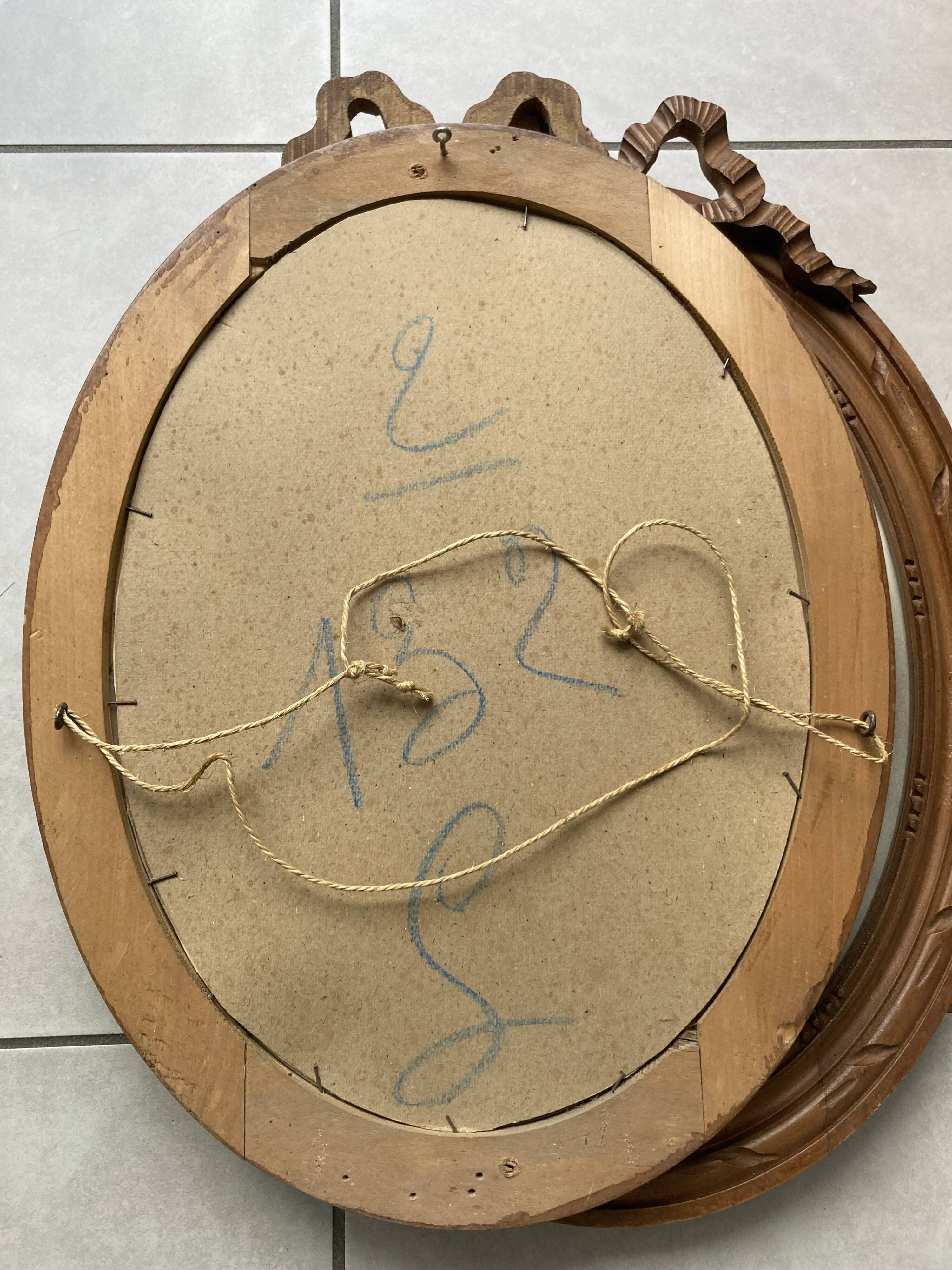 Pair of portraits of a couple in a 1900s knotted frame