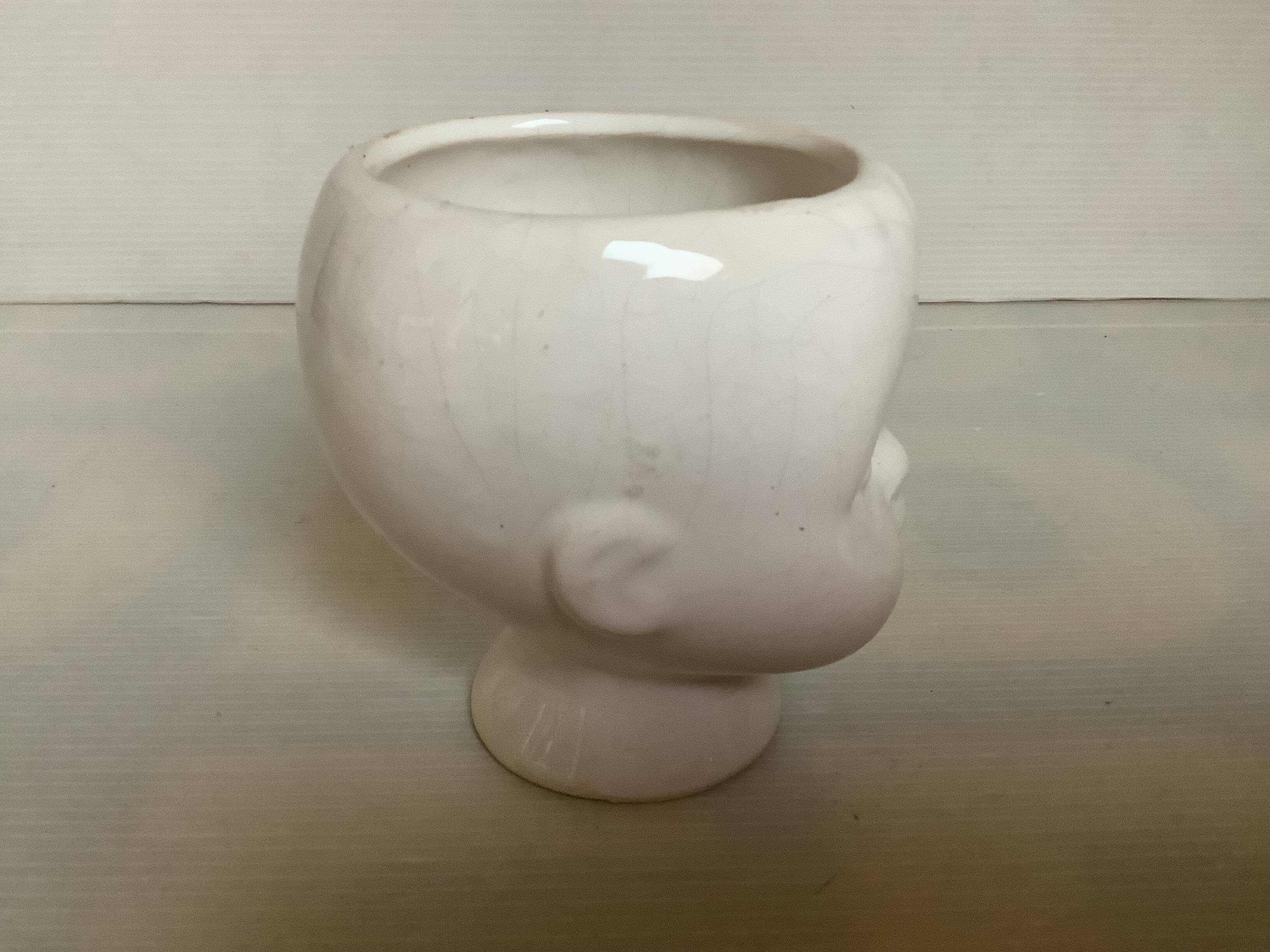 Baby doll shaped vase planter