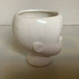 Baby doll shaped vase planter