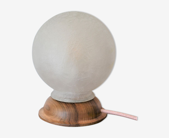 White glass globe table lamp with geometric reliefs