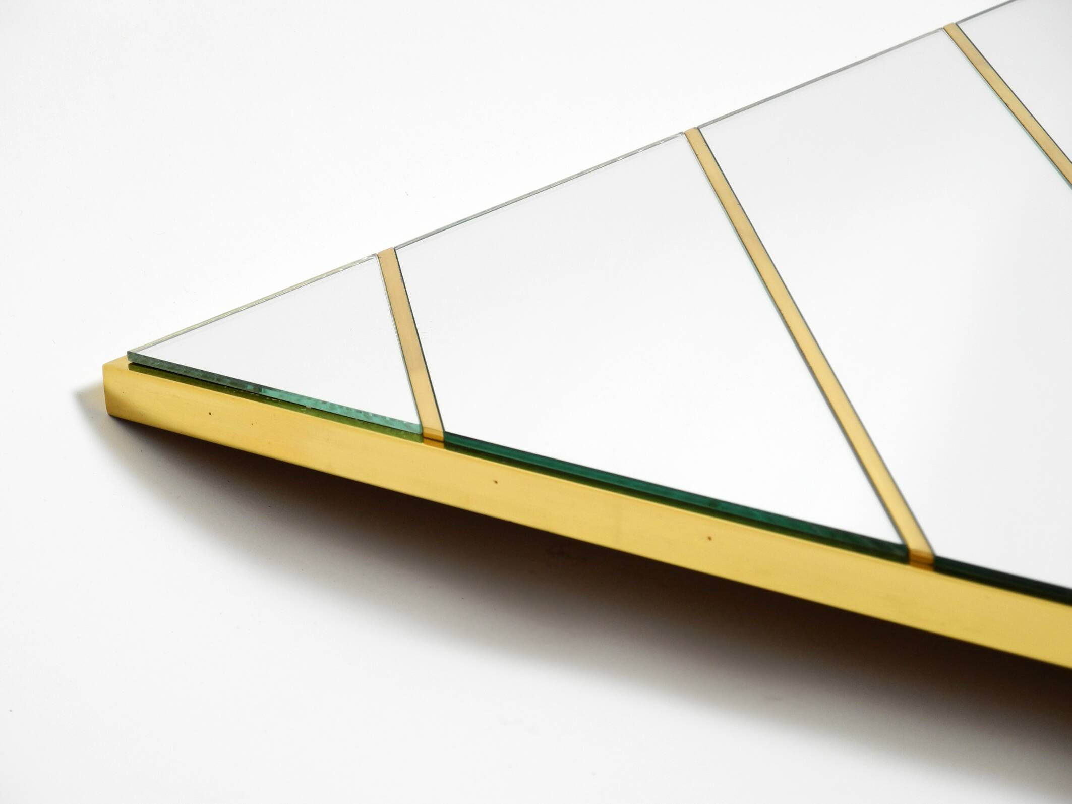 Large, exceptional 1970s brass wall mirror with diagonal mirror strips