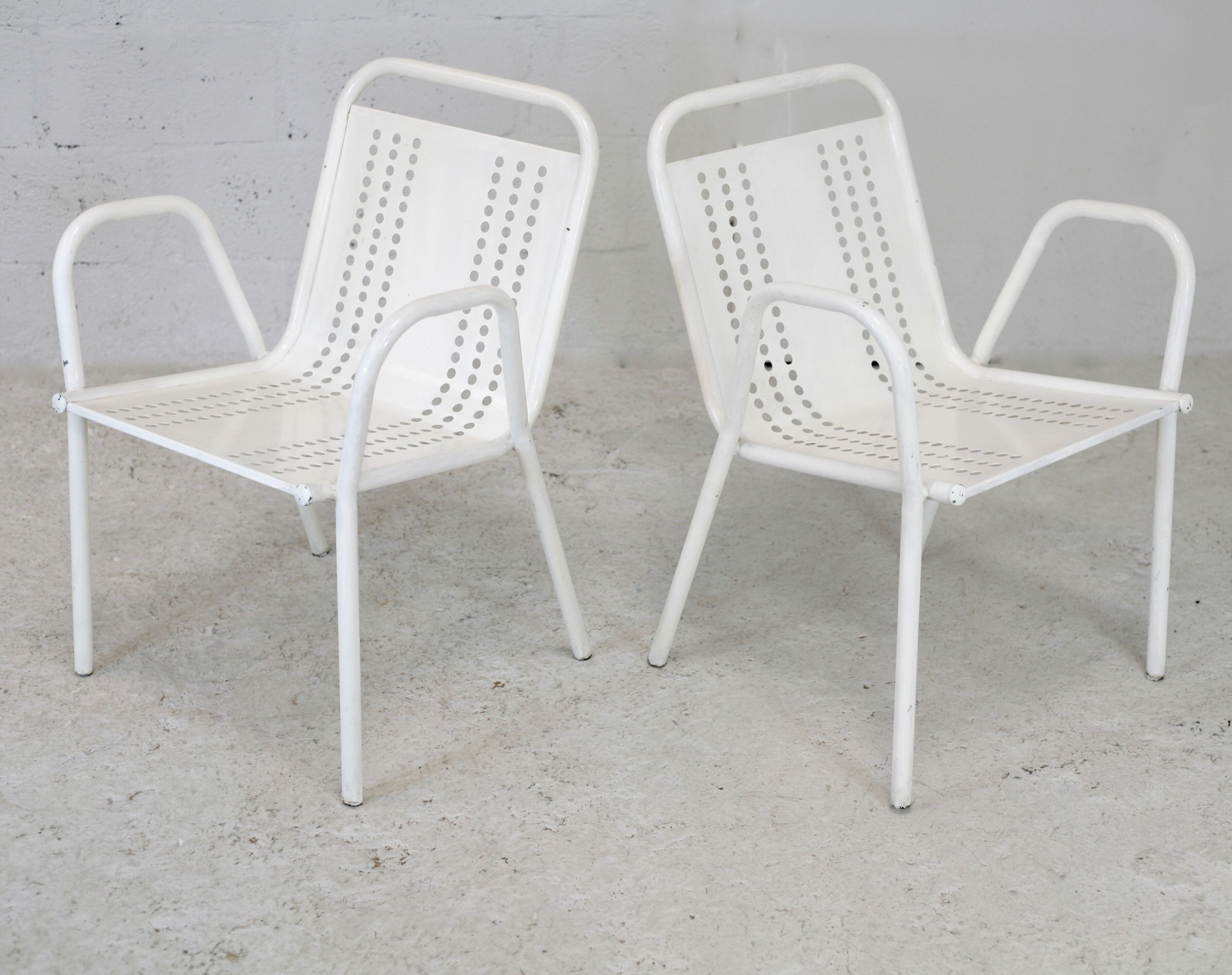 Pair of honeycomb steel armchairs. France, circa 1950.