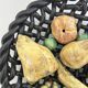 Large woven bowl and trompe l'œil fruits