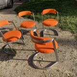 Four stainless steel armchairs from the 70s