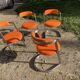 Four stainless steel armchairs from the 70s
