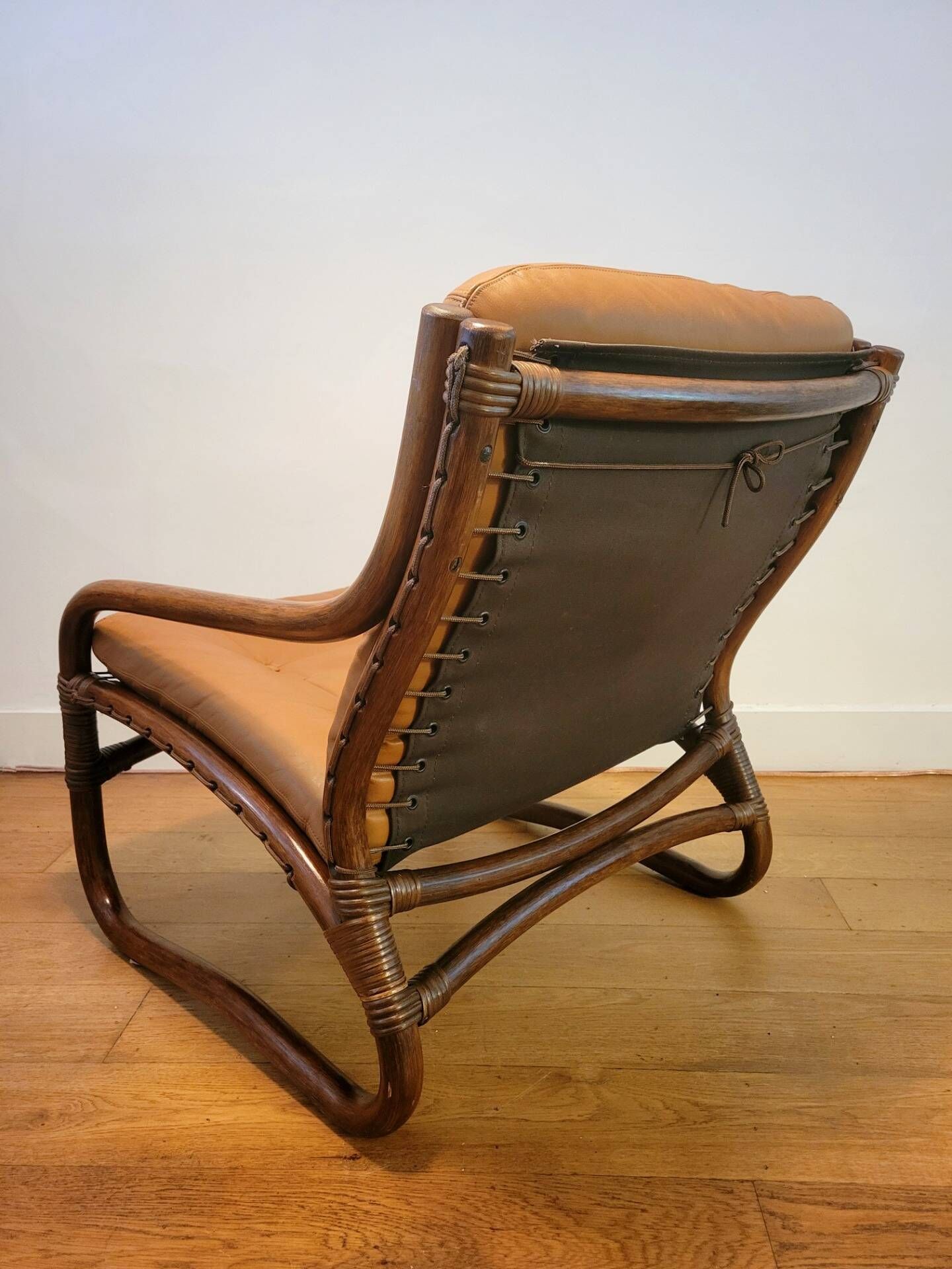Vintage rattan armchair with leather cushions from 1970