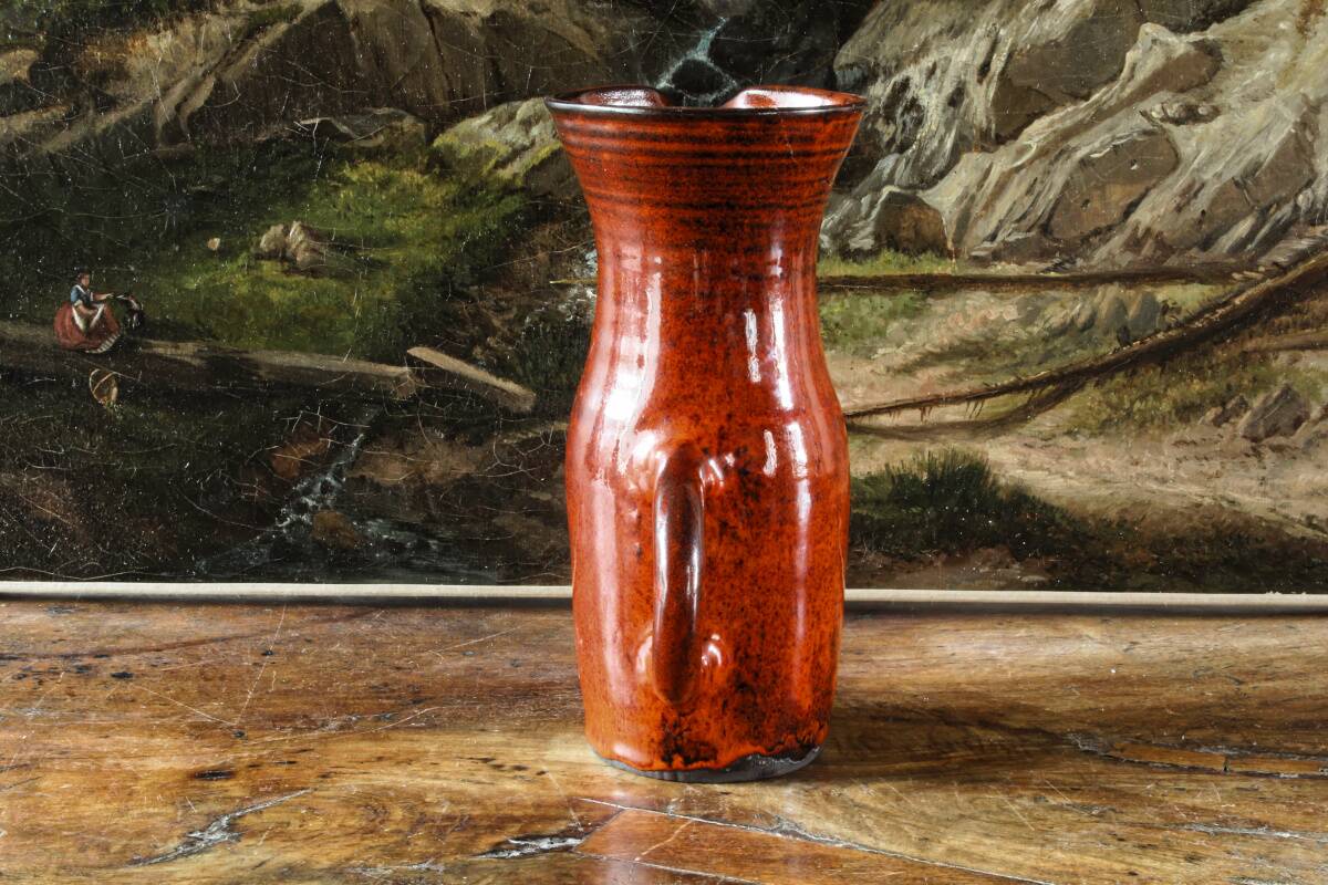 Signed orange ceramic candle holder and jug