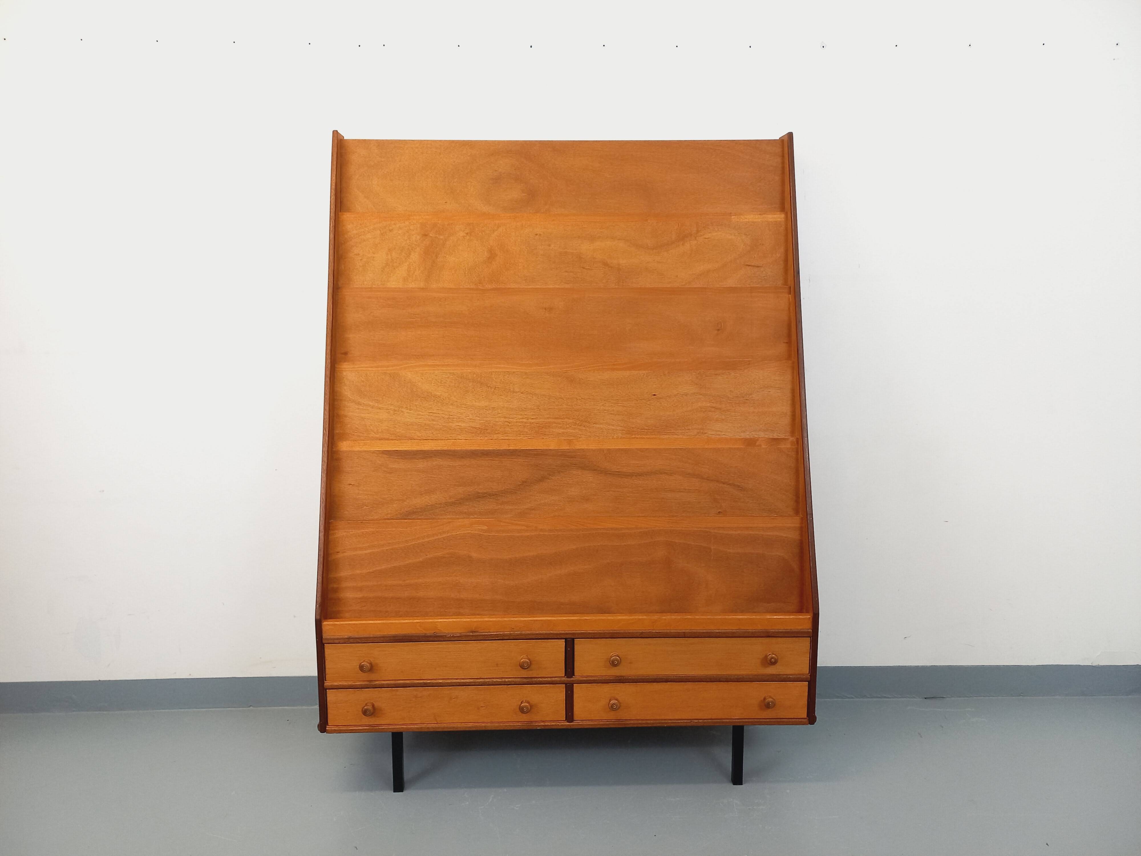 Vintage wooden display bookshelf with drawers from the 1960s.