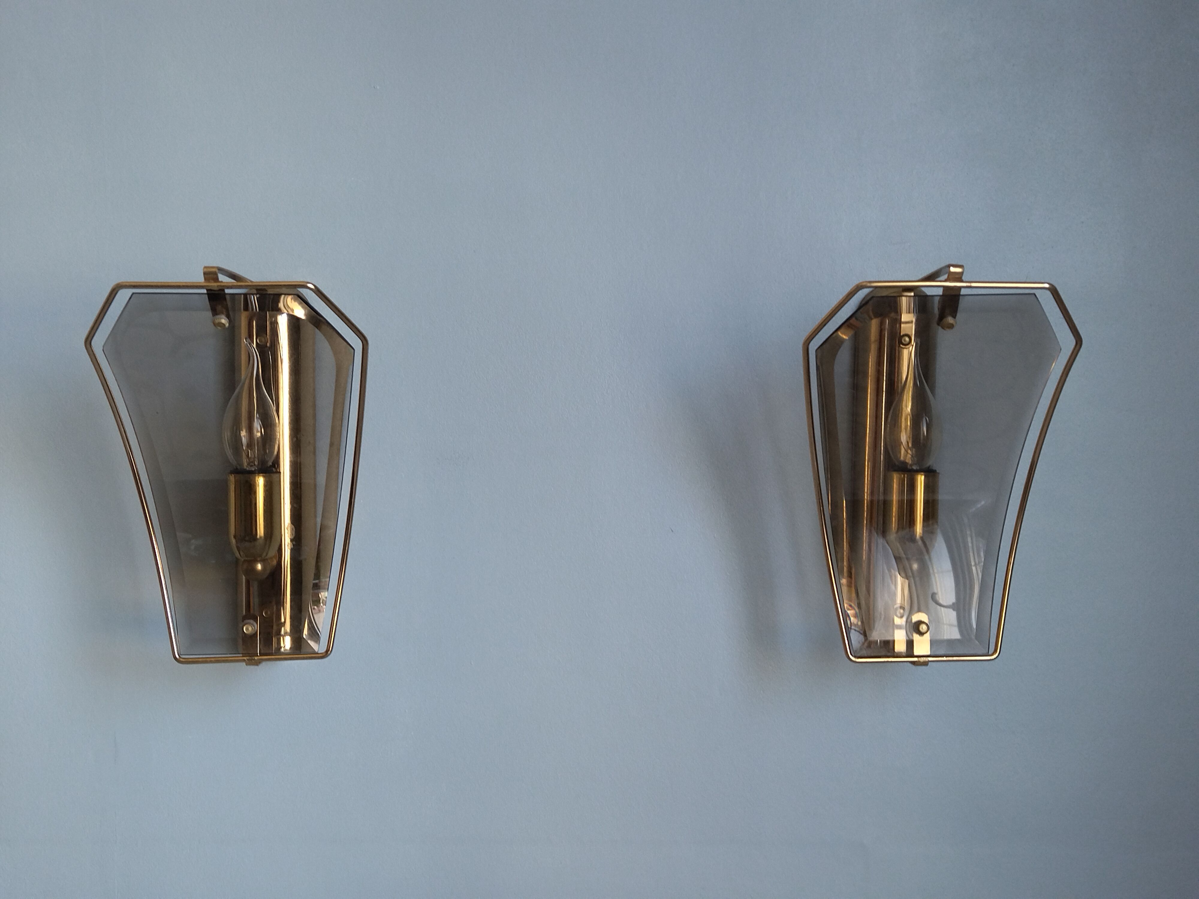 Pair of brass and curved glass wall lamps from the 80s