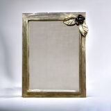 Vintage wall mirror in varnished steel decorated with a rose in relief