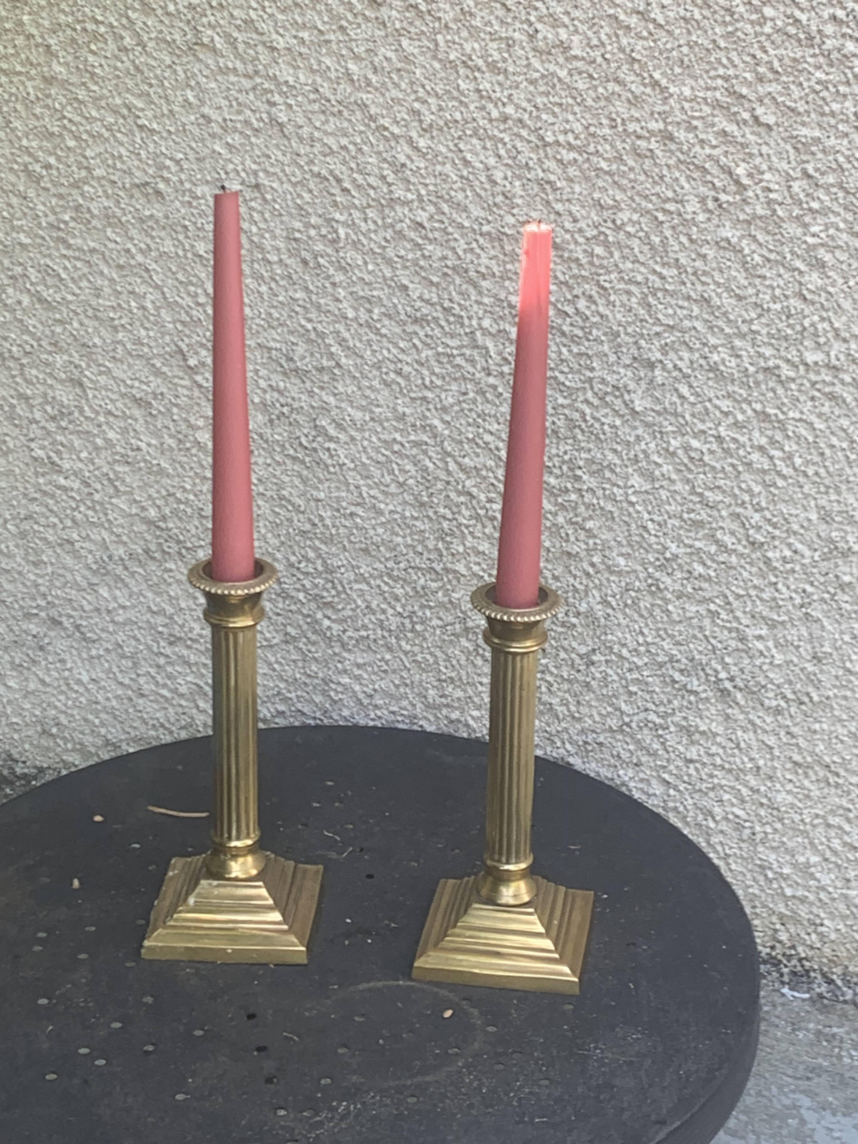 Pair of gilded brass candlesticks, vintage column shape