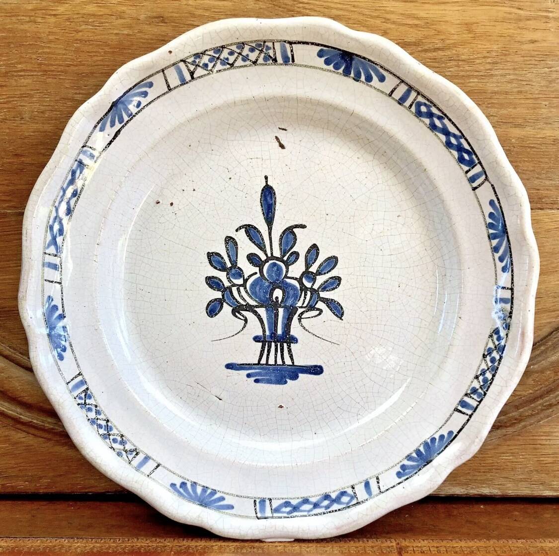 Old round hollow dish XVIII black bottom Rouen Forges les eaux