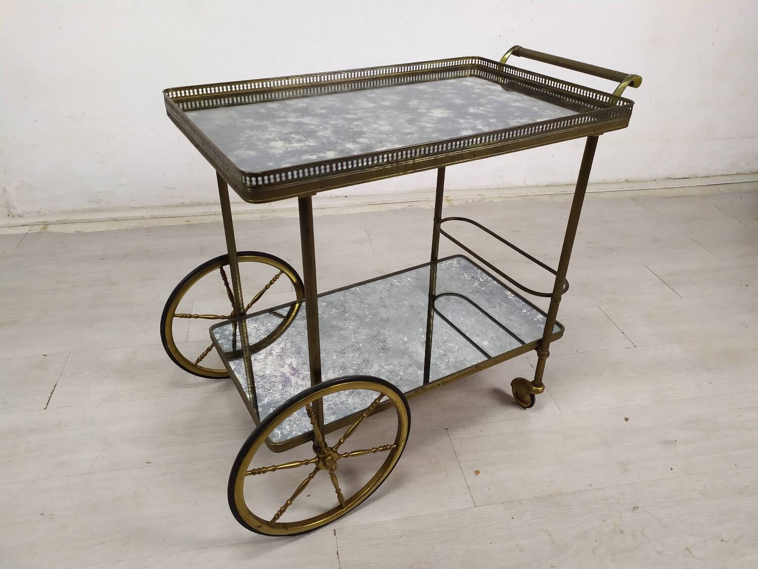 Brass and glass rolling trolley