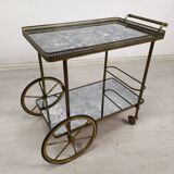 Brass and glass rolling trolley