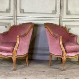 Pair of Louis XV style bergère armchairs in carved wood, pink velvet, circa 1900