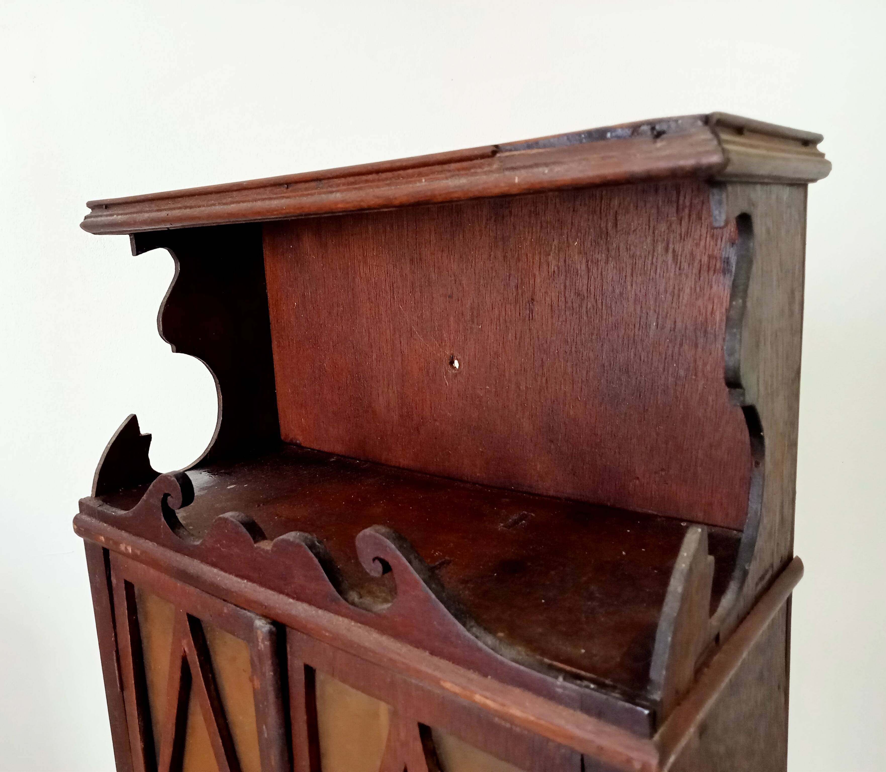Small antique wall cabinet in Gothic style.