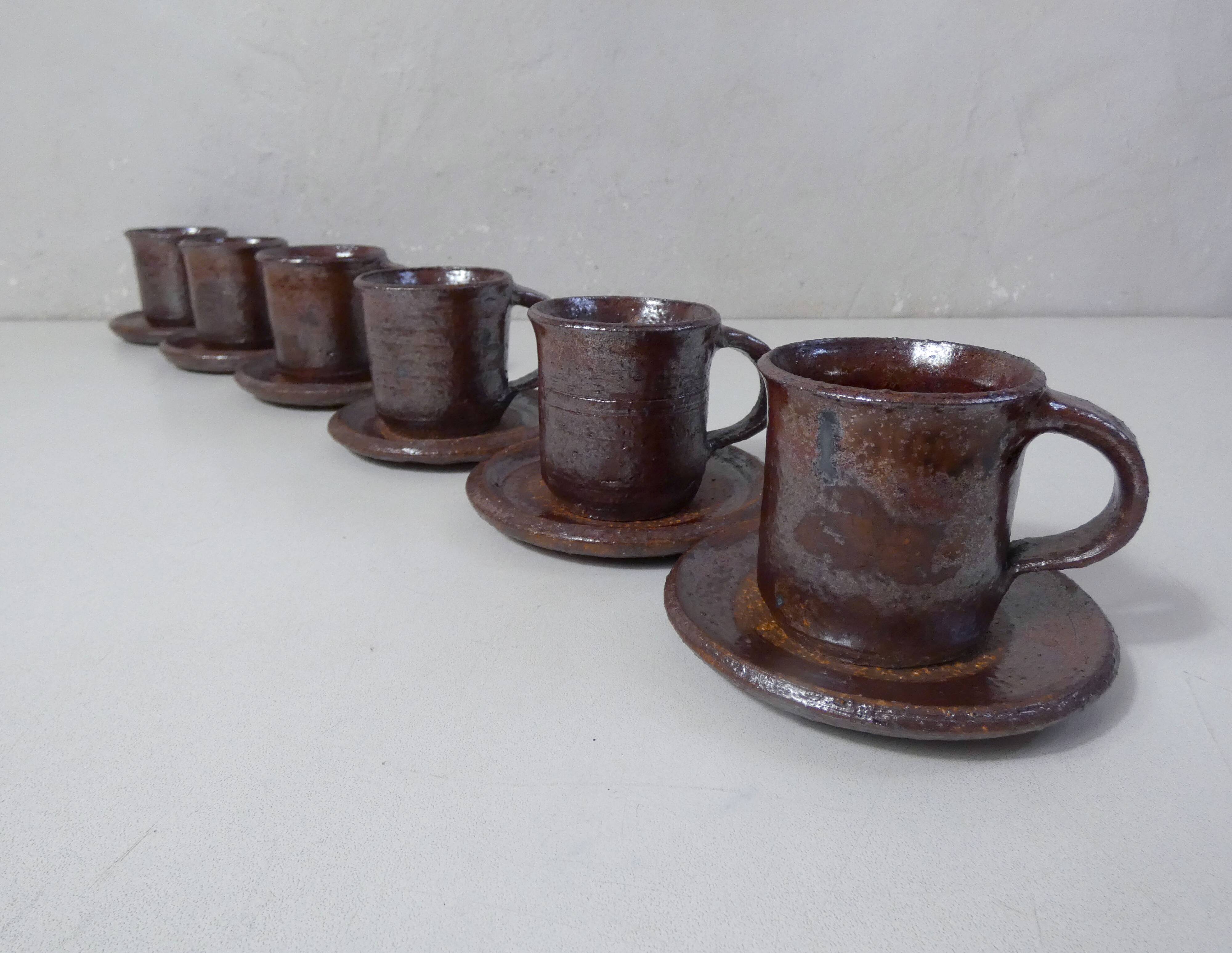 coffee service in iridescent stoneware cups and vintage sugar bowl