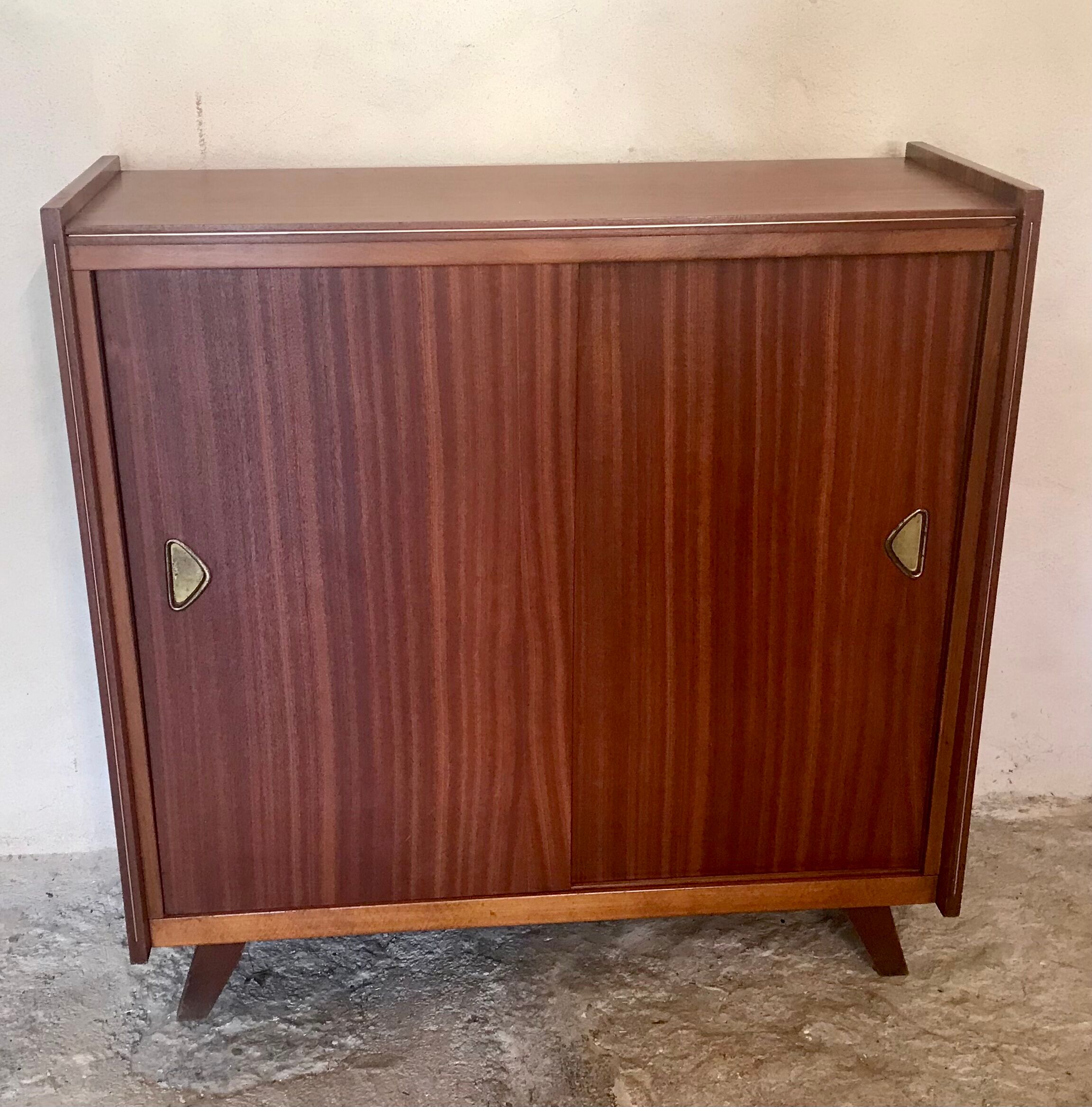 Vintage storage cabinet teak veneer sliding door compass feet