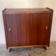 Vintage storage cabinet teak veneer sliding door compass feet